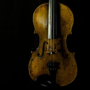 brown violin with black background