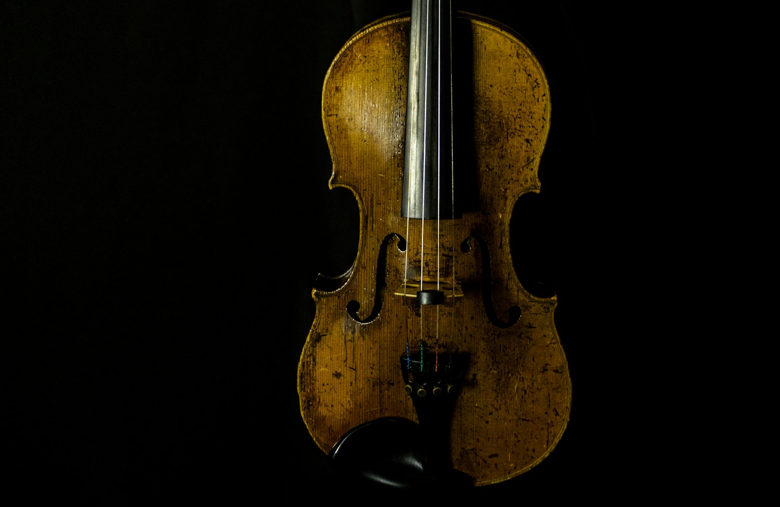 brown violin with black background