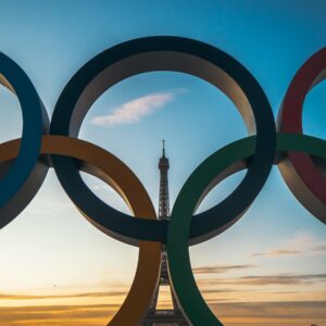 the olympic rings in front of the eiffel tower